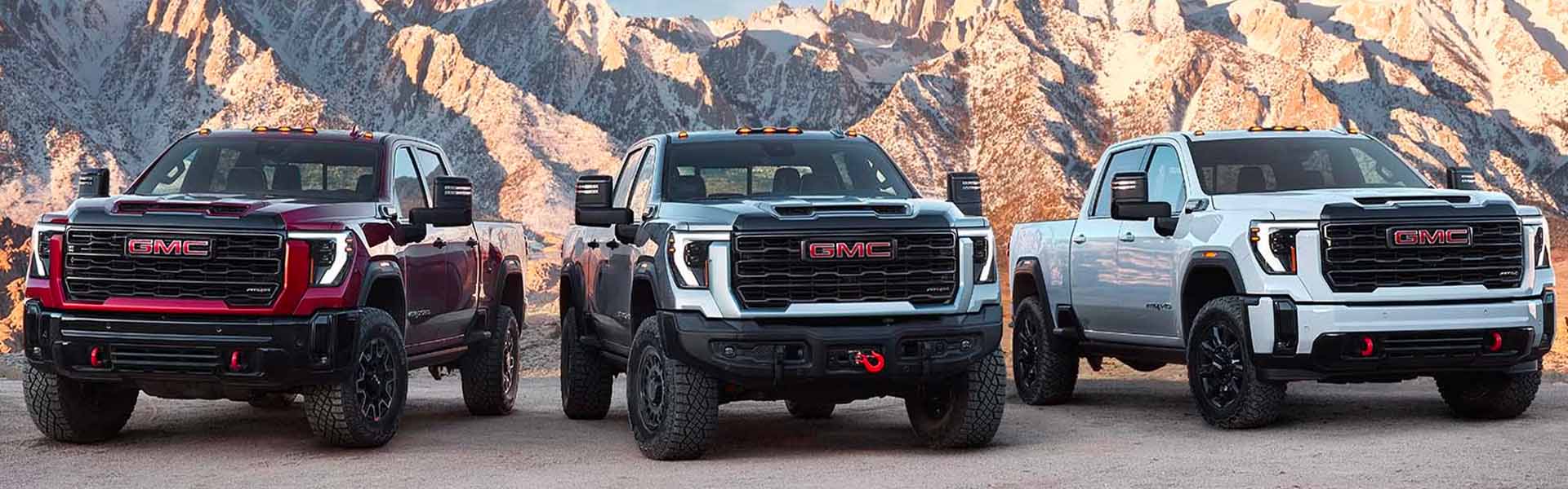 GMC Sierra fleet standing hills behind