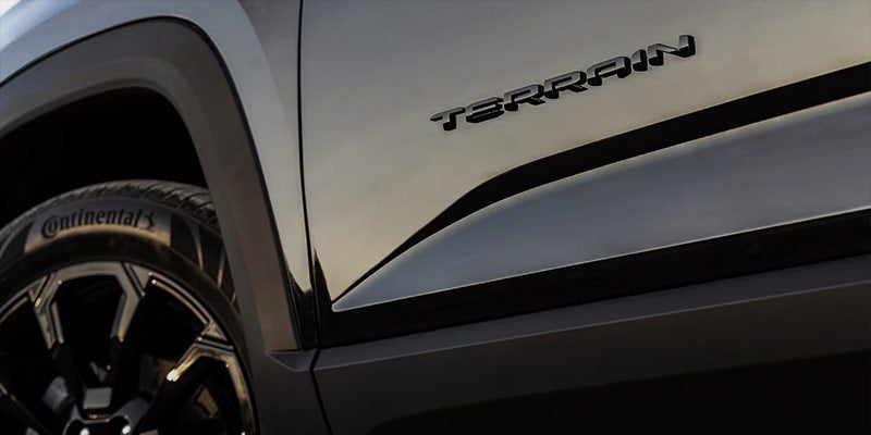 black terrain logo on car