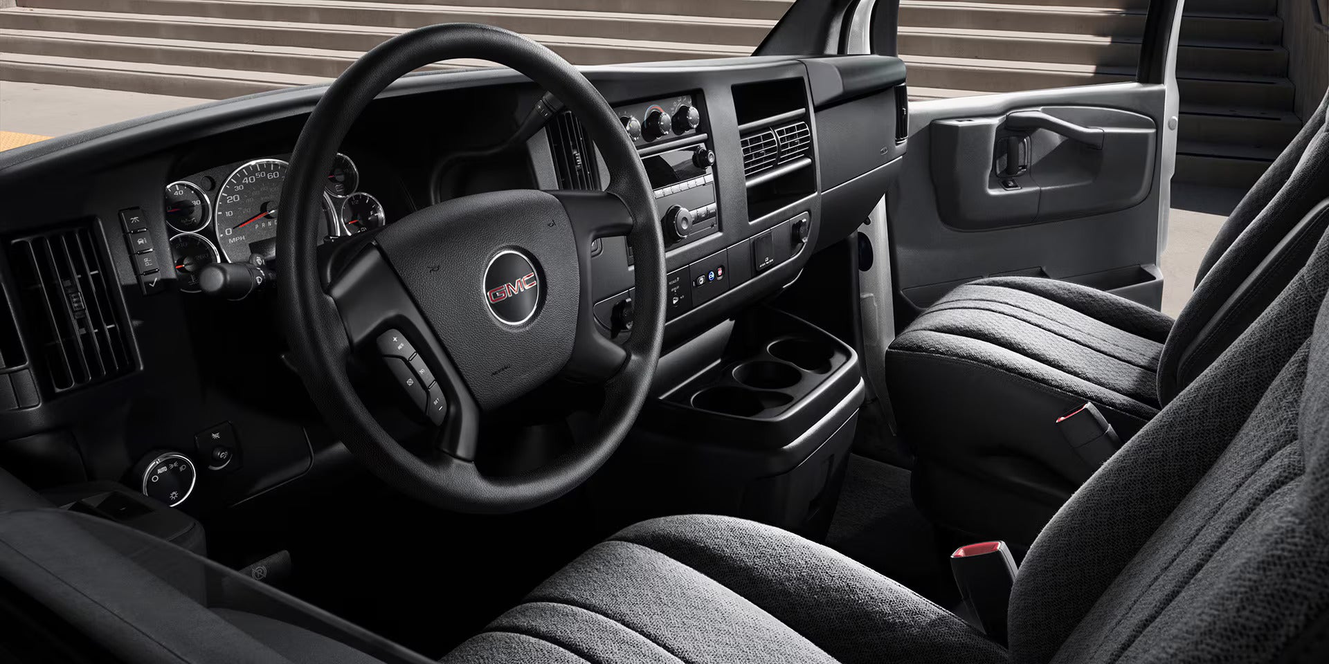 GMC savana cargo seating and dashboard showing features